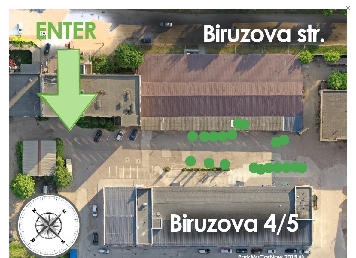 A top view of the car park at Biruzova 4/5 in Minsk with free spaces marked by green dots